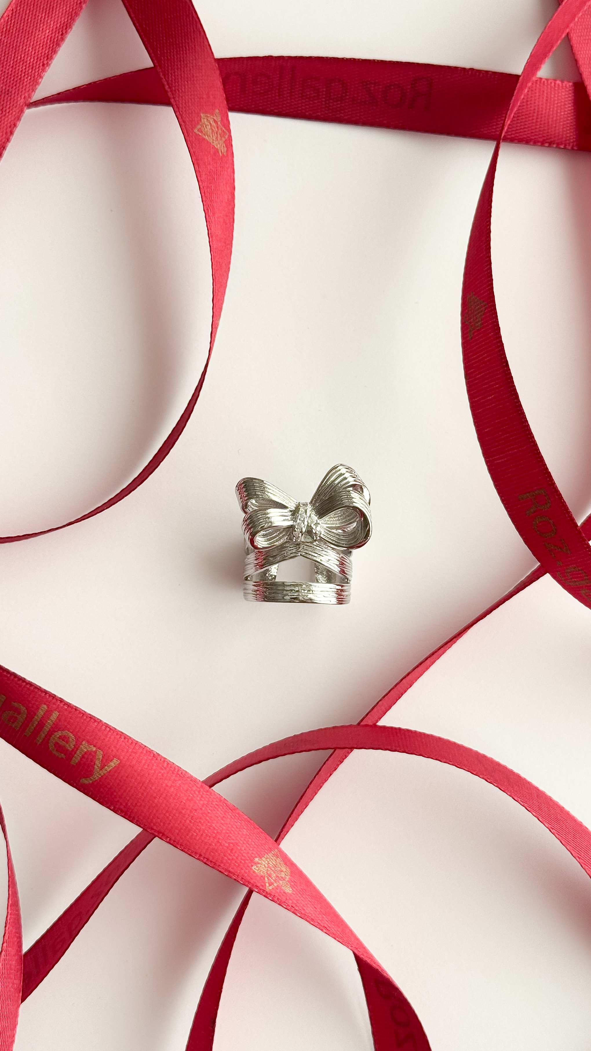 انگشتر پاپیون با رینگ چند لاین کد 8 رنگ نقره ای انگشتر پاپیونی نقره ای